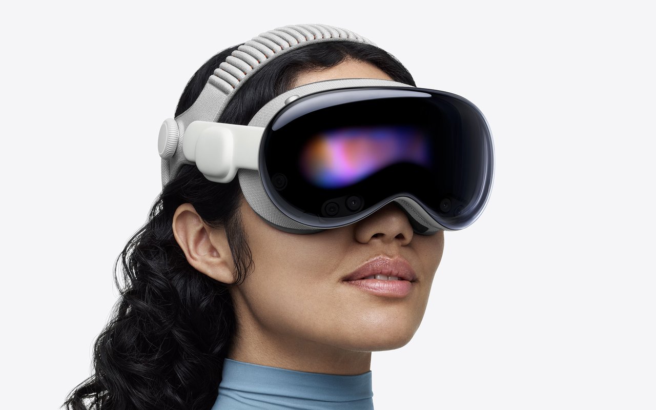 A woman wearing Apple Vision Pro with its knit headband, seen in profile