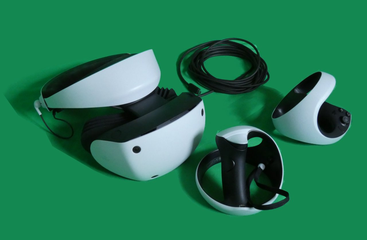PlayStation VR2 headset with its cable and two Sense controllers